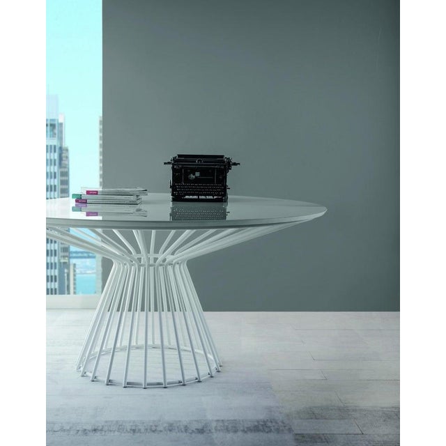 Round wire cage dining table with white top glass top with powder coated metal pedestal base. Beautiful mid century style....