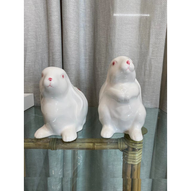Handmade and painted in Italy, delicate light pink Hydrangeas floral design porcelain bunnies figurines. Italy marked on...