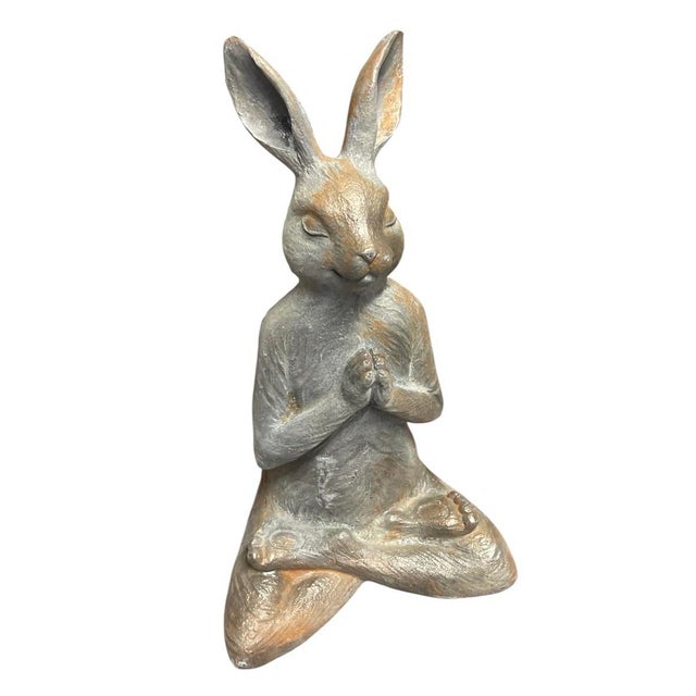 This charming vintage cast iron statue depicts a stylized hare captured in a serene, meditative pose. Seated cross-legged...