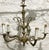 8” chain 16” across 19” tall 20” wire Elevate your space with the regal charm of this 5-light vintage chandelier. This...
