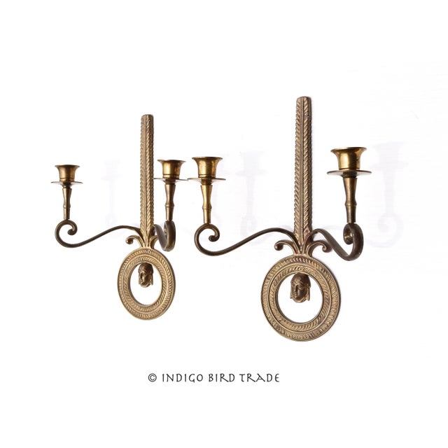 Magnificent Pair of Vintage Neoclassical Brass Wall Sconces These stunning sconces are made from solid brass and represent...