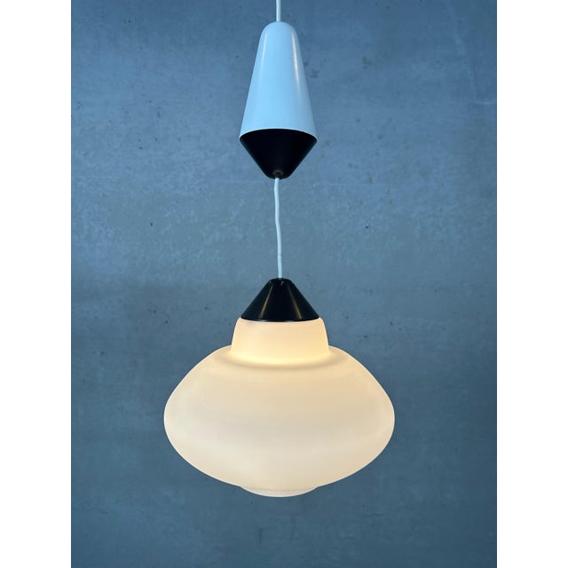 Vintage Philips pendant lamp with opaline shade. Louis Kalff. Total length: 70cm. Diameter: 26cm. Weight: 1.2kg. The...