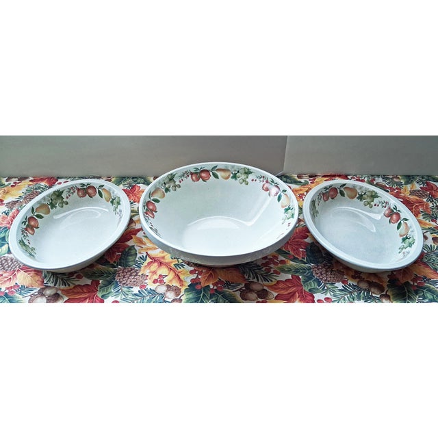 Set of three vintage Quince by Wedgewood serving bowls. They feature a fruit design around the inside of the bowls on a...