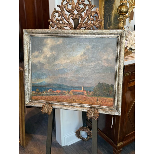 A luminous 1932 oil on canvas by Belgian painter Gregoor Van Puyenbroeck (1906–1982), depicting the village of...
