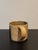 Textured and pottery glaze pattered stoneware mug signed by artist.