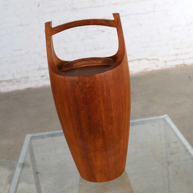 Handsome and iconic staved teak ice bucket by Jens Quistgaard for Dansk. This is the monumental 19.25-inch-tall example....
