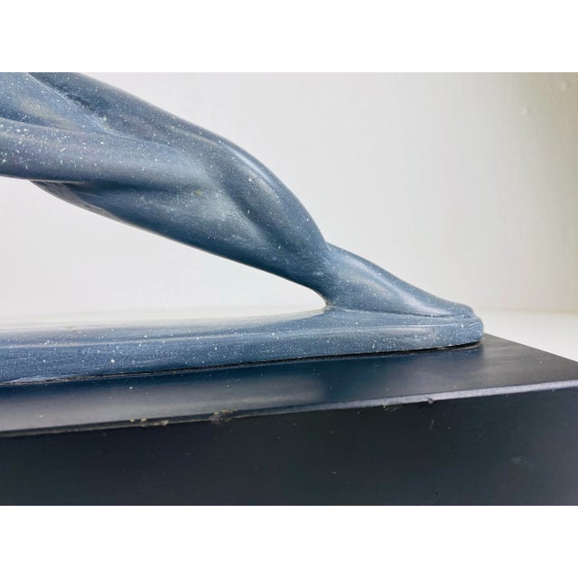 This is a mid century modern Austin Productions art deco inspired abstract female nude sculpture. The sculpture has a gray...