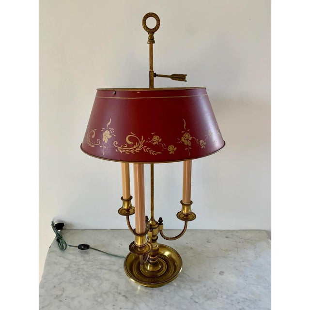 A gorgeous French Provincial Louis XVI style brass three-arm bouillotte lamp with red & gold tole shade USA, Mid-20th...