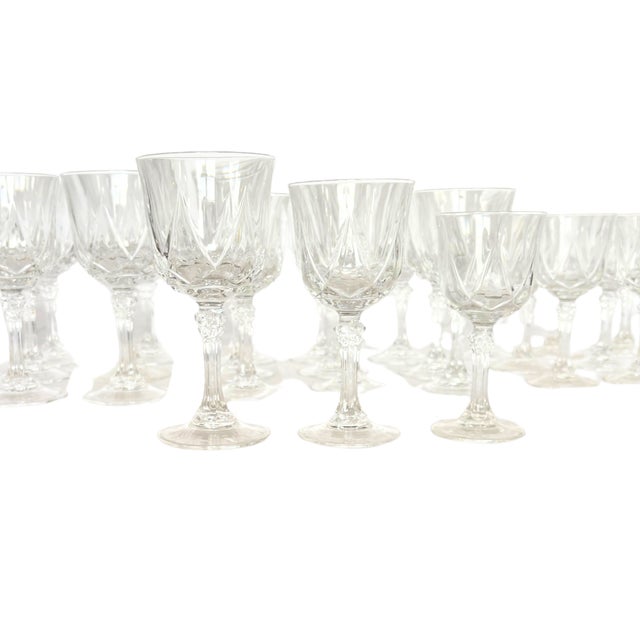 An elegant and complete crystal service by Cristal d’Arques, featuring the timeless Auteuil pattern. This vintage set...
