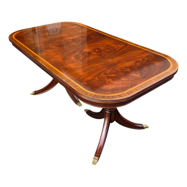 Featured is a Jonathan Charles Regency Crotch Mahogany Non-Extendable Dining Table. Elegant and timeless, this antique...