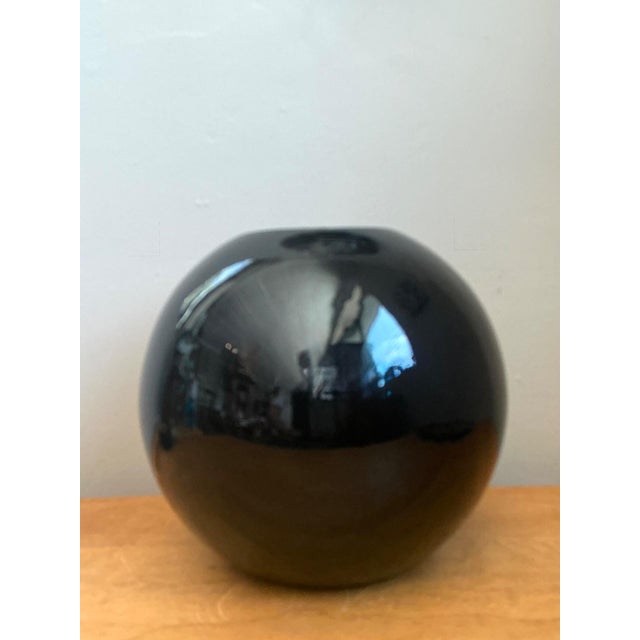 This striking vintage sphere vase is a masterclass in minimalist form and modernist execution. Crafted from heavy ceramic,...