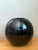 This striking vintage sphere vase is a masterclass in minimalist form and modernist execution. Crafted from heavy ceramic,...
