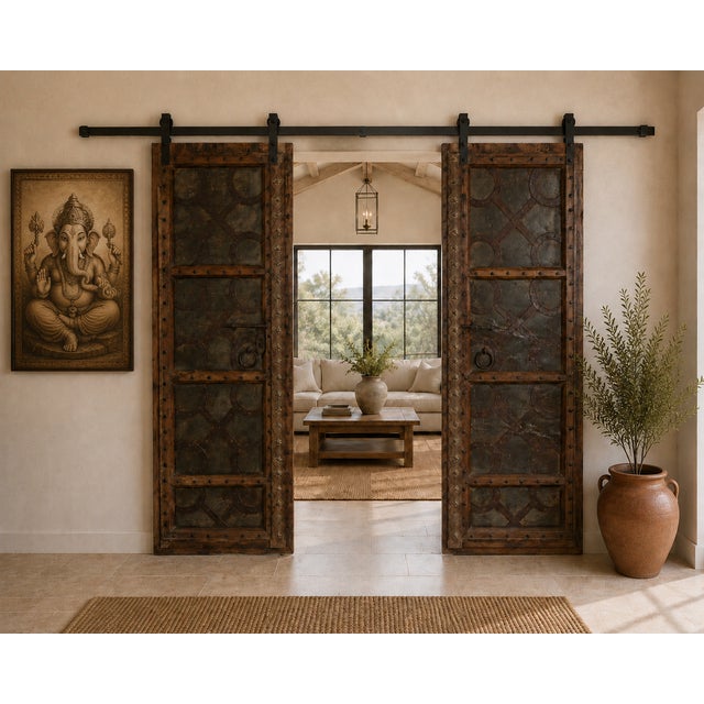 Antique Indian Carved Teakwood and Iron Door, the frame with decorative nailheads, a carved center style with brass...