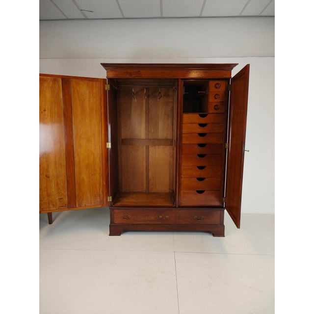 A superb and spacious wardrobe crafted from rich mahogany by the renowned makers h. Pander & zonen . This late 19th-...
