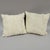 A pair of 2004 white fur pillows that are duck feather and down filled. We can't identify the fur, but it is...