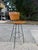 Mid century Arthur Umanoff style bar stool. The stool features Umanoff’s classic wood slats and wrought iron frame. The...