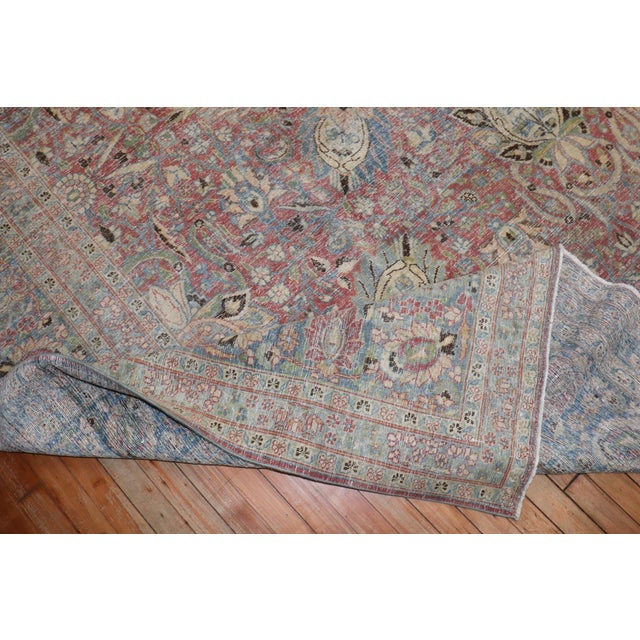 1920s Persian Meshed Rug in a dominant raspberry tone