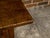A French walnut desk from the early 19th century with three drawers, carved motifs, H-Form cross stretcher and nice...