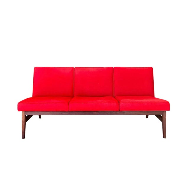 In its original vibrant red fabric, this 1960s teak Danish Modern sofa makes quite a statement. An upholstered frame...