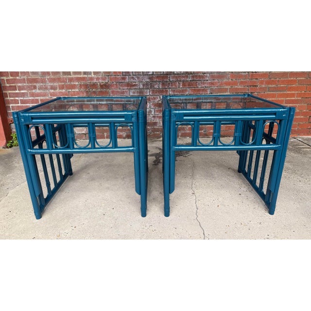 Elevate your interior with these exquisite Vintage Bohemian Palm Beach Regency Style Rattan Side Tables, now elegantly...