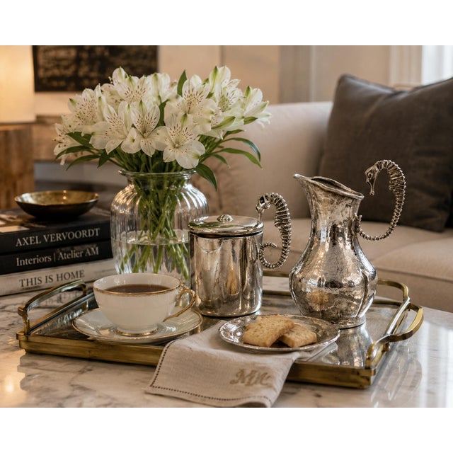 Exceptional Mexican Modernist silver-plated creamer and lidded sugar pot by Los Castillo, designed and handcrafted in...