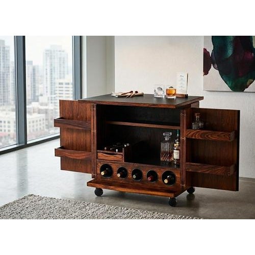 Danish mid-century drinks cabinet in rosewood on casters, designed by Illum Wikkelsø and produced by Silkeborg Møbelfabrik...