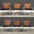A set of six mid century modern chome dining chairs with cane backs and rosewood arms designed by Paul McCobb for Lane....