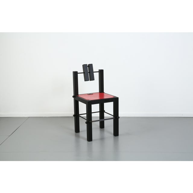 Painted aluminum chair, enameled steel rods, plastic hole covers. One-of-a-kind. Signed "SA." This piece has an...