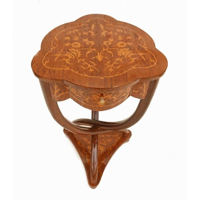 Elegant French occasional table in the Art Nouveau Revival taste Fine quality walnut with beautifully executed floral...