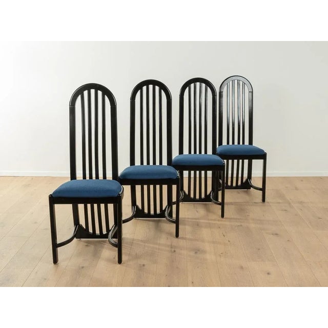 Postmodern 1980s dining chairs. Solid frame in black. The chairs have been reupholstered and covered with a high-quality...