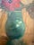 This delightful painting depicts a bouquet of white, pink, red, and violet anemones. The green-glazed terracotta vase...