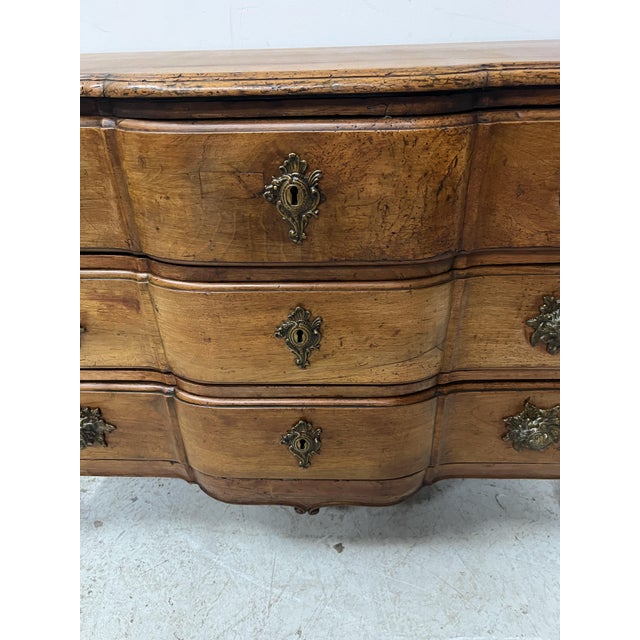 Louis xv commode with a central projection in solid walnut three drawers in the front with bronze knobs old restorations...