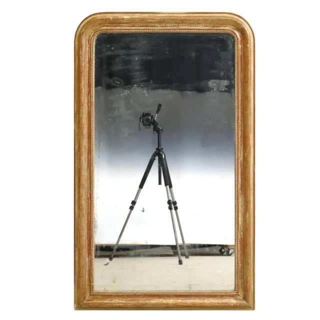 Beautiful French Louis Philippe period giltwood wall mirror, mid 19th c., having arched frame, with incised foliate motifs...