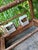 An original, large wooden birdcage from the first half of the 20th century. Made of softwood, it features metal bars, a...