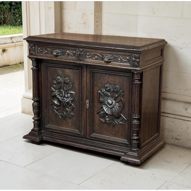 A 19th century French Renaissance Revival buffet carved in oak, celebrating the bounty of the French countryside in deep...