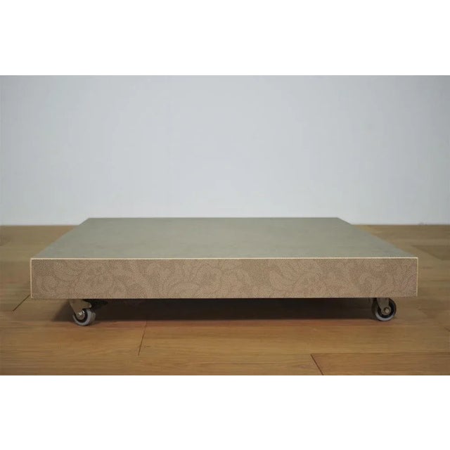 Handcrafted design low ceramic glass coffee table with wheels and brake 2000s.