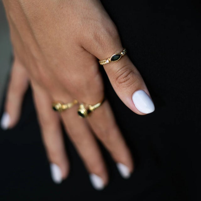 Bold yet elegant, the Black Onyx Teardrop Gemstone Adjustable Gold Ring carries a sense of mystery and strength. The...