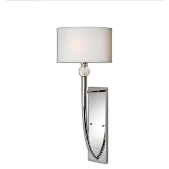 A wonderful pair of new (discontinued) extra large polished chrome and lucite wall sconce lamps. The sconces are for...