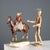 A young woman on horseback in polychrome ceramic, an elegant and refined sculpture. The base bears a manufacturer's mark...