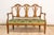 A Florentine walnut sofa from the 18th century from the Villa Fioravanti, with carved lyre motifs, scrolling arms and...