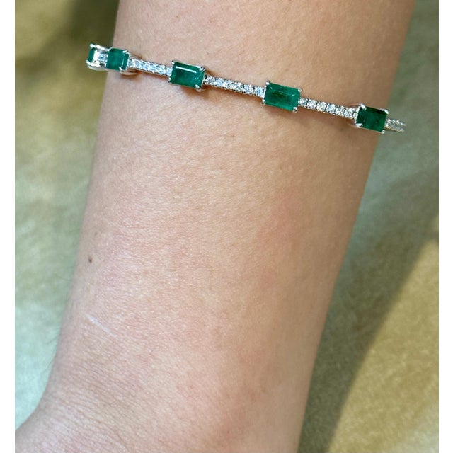 Introducing our exquisite 14 Karat Yellow Gold Bangle Bracelet adorned with approximately 3 carats of Natural Brazilian...