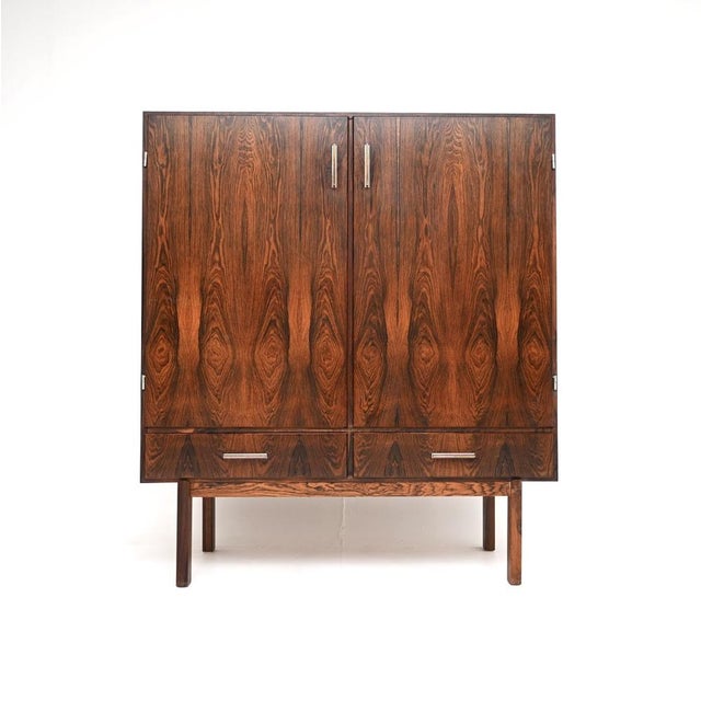A stylish and very impressive Danish vintage drinks cabinet by Axel Christensen. It was made in Denmark by ACO Mobler, it...