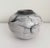 Stunning ceramic, raku vase featuring white/taupe glaze and heavy black crazing. Artist signed. This type of raku features...