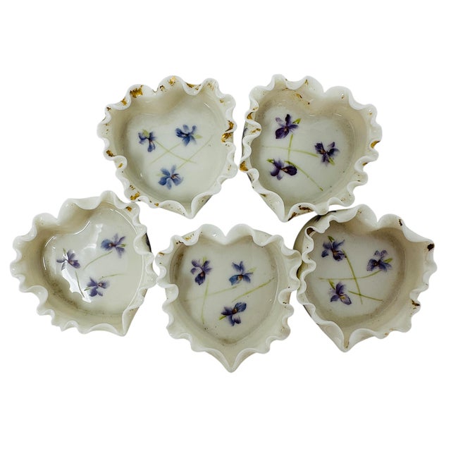 A charming set of five (5) miniature hand-painted porcelain dishes, likely open salt cellars or small pin dishes,...