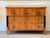 A Biedermeier cherry wood commode, circa 1825, possibly from Vienna, with a molded top over three long drawers faced in...