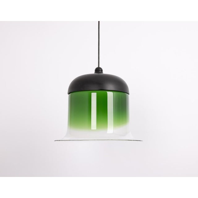 A special form of glass pendant designed by peill & putzler, manufactured in germany, circa 1970s. Wonderful green color...