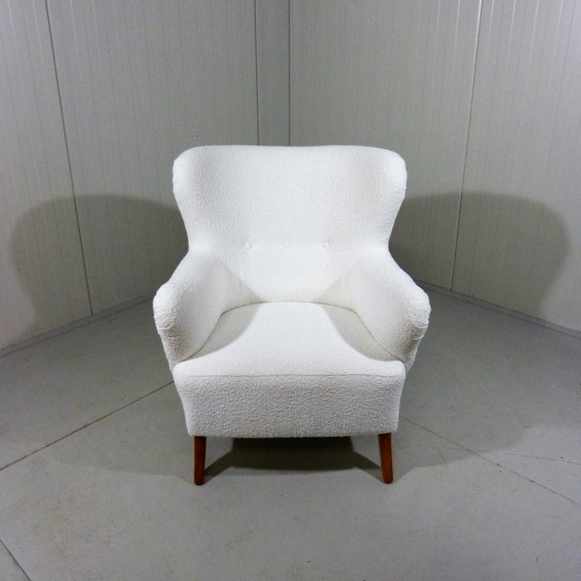 Very nice arm chair, Sweden. Comfortable spring coiled seat, new furnished with white boucle fabric.