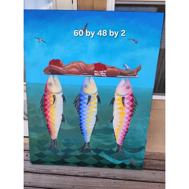 Very interesting and unusual painting of a man laying on a surfboard supported by three fish.