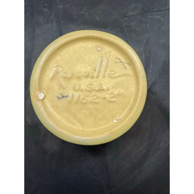 This Vintage Roseville Pottery Zephyr Lily Single Candle Holder 1162-2 in Evergreen is an original piece from 1946,...