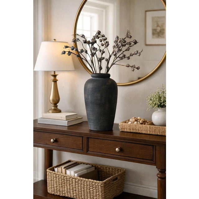 This 11-inch rustic ceramic vase features a timeless farmhouse design that adds warmth and elegance to any space. Perfect...